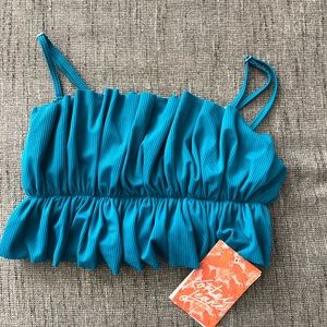 Kortni Jeane med ocean depth blue oversized ruffle